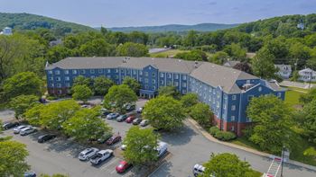 Aerial view of apartment building with parking view